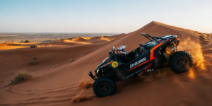 Powerful orange dune buggy climbing steep red sand dune at sunset in Lahbab Desert Dubai with sand spraying from wheels during exhilarating self-drive adventure