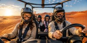 Happy family of four riding in a 4-seater self-drive dune buggy through red sand dunes in Lahbab Desert Dubai during golden morning