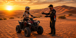 Beginner rider learning quad biking on the Lahbab Desert red dunes during cool morning hours with instructor supervision