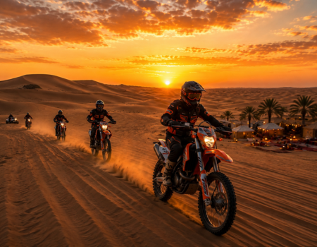 Desert motorbike tour across Dubai sand dunes at sunset